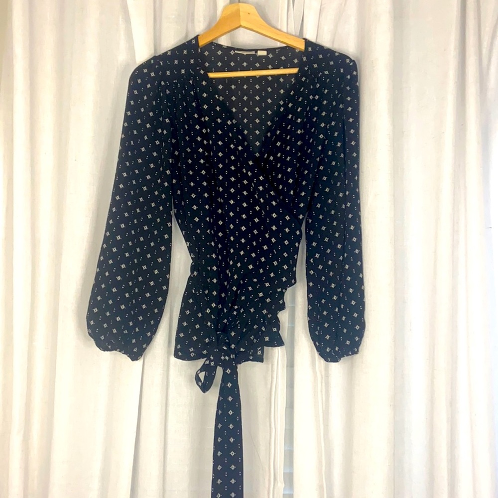 Black patterned wrap top with billowing sleeves